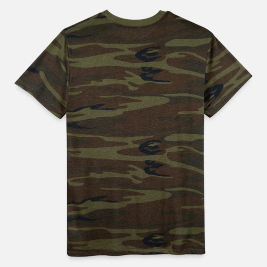 A cat peeking out from behind a flowerpot